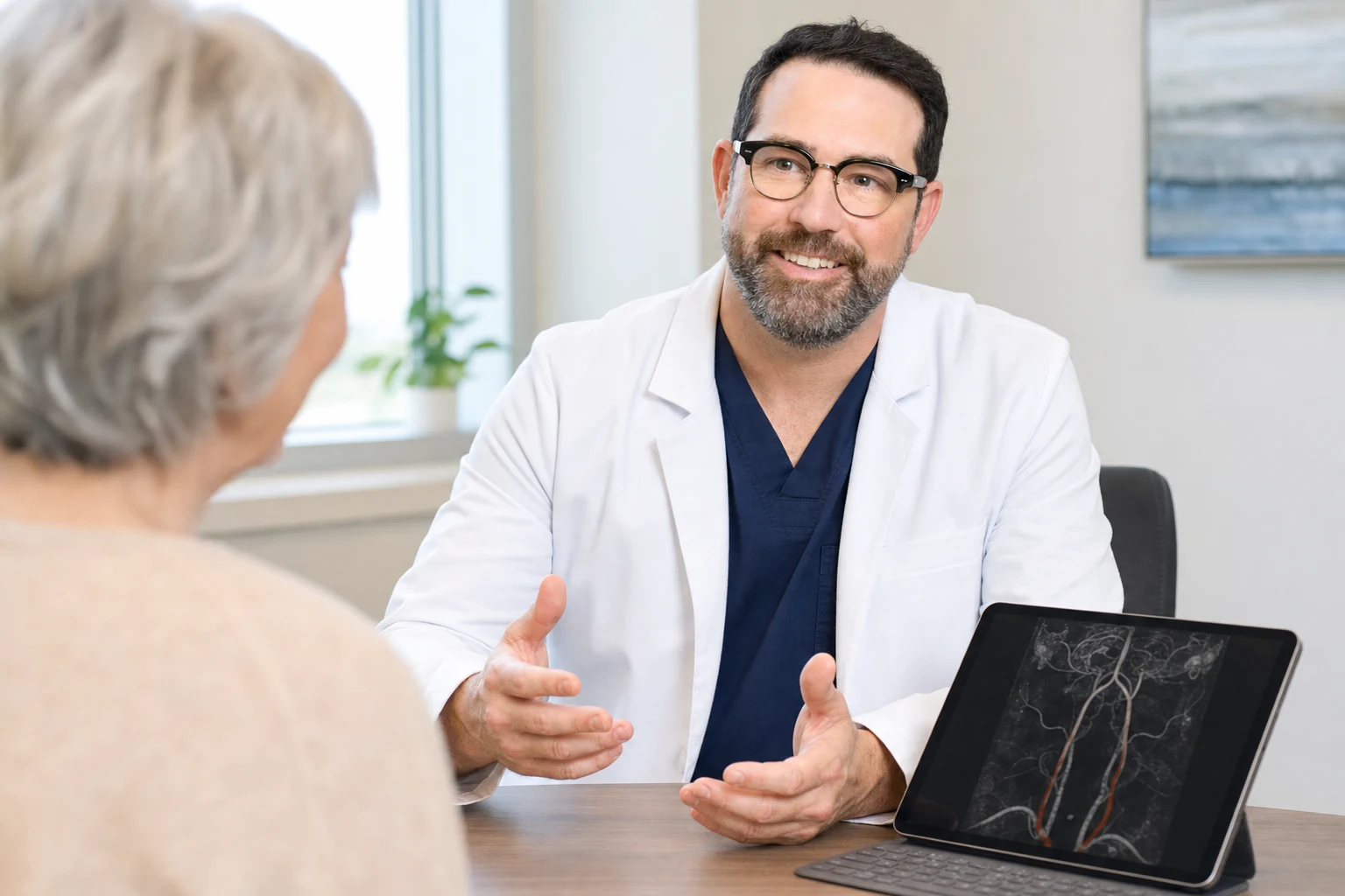 Austin Wagner speaking with a patient during a consultation
